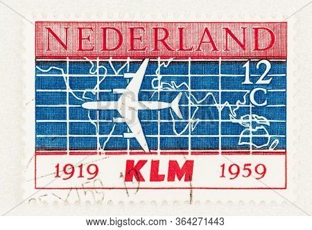 Seattle Washington - May 1, 2020: Stamp Of Netherlands Featuring Douglas Dc-8 Airliner With Map Back