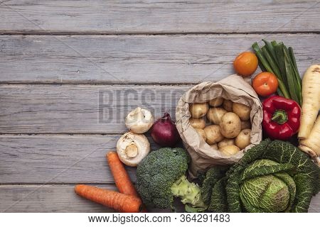 Layflat Composition Of Fresh Vegetables Arranged On A Wooden Background