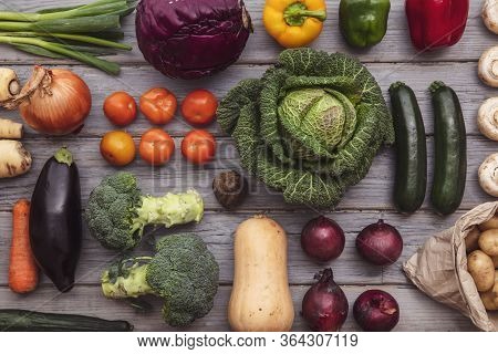 Layflat Composition Of Fresh Vegetables Arranged On A Wooden Background