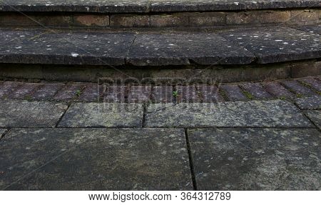 Background Of Dirty Looking Patio And Step With Mould Growth And Weeds