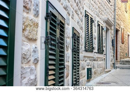 Winding Street Of The Authentic, Old Town Of Herceg Novi, Montenegro. We See Old Houses And Very Nar