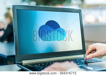 Poznan, Pol - Apr 24, 2020: Laptop Computer Displaying Logo Of Microsoft Onedrive, A File Hosting Se