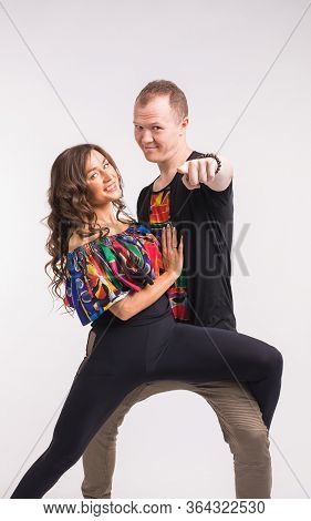 Funny Couple Dancing Social Dance. Kizomba Or Bachata Or Semba Or Taraxia , On White Background. Soc