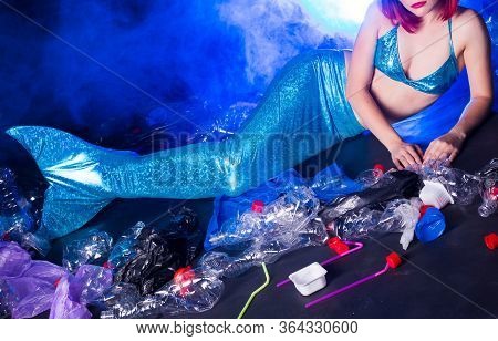 Ocean Plastic Pollution Concept. Mermaid Scared Due To Polluted Habitat.