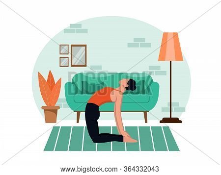 Young Beautiful Slender Girl Practices Yoga At Home In The Living Room During Quarantine. Healthy Li