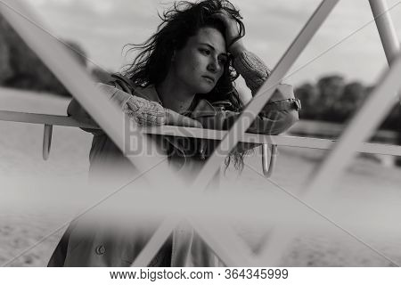 Woman Holding Her Hand Near The Head And Thinking