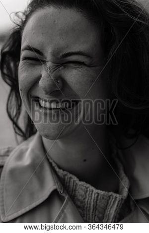 Close Up Portrait Of The Smiling Woman