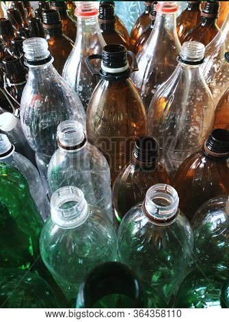 Plastic Bottles Without Caps.vertical Photo For Banner. Recycling Plastic.green,brown And Transparen