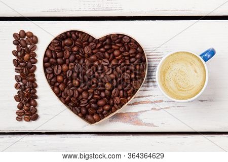 I Love Fresh Morning Latte With Foam. Roasted Beands In A Shape Of Heart And Letter I. White Wood On