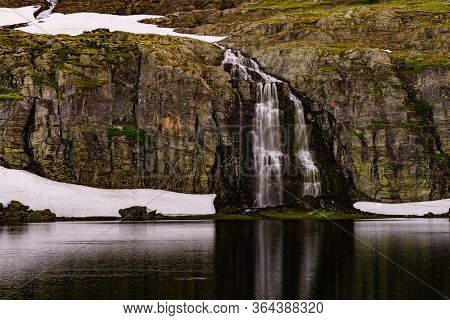 Mountain Lake Flotvatnet With Waterfall. Scenic Region Between Aurland And Laerdal In Norway. Nation