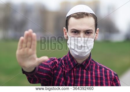 Handsome Young Jewish Guy In Traditional Jewish Male Headdress, Hat, Boom, Or Yiddish On Head. Man I