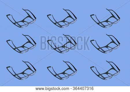 Sunglasses On Blue Background Pattern. Hard Light