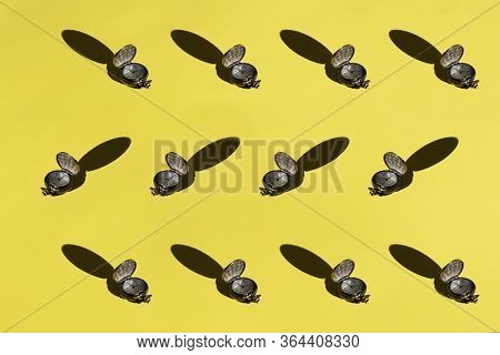 Pocket Watch Pattern On A Yellow Background, Flat Lay.