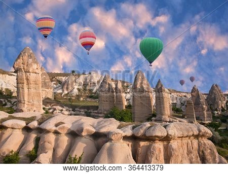 Unique Geological Formations And Colorful Hot Air Balloons Flying Over Baglidere, Or Love Valley, Ca