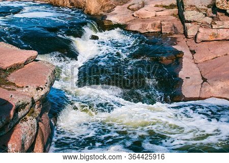 Waterfall Spring Water Landscape At The Daytime. Magmatic Stones Breed.
