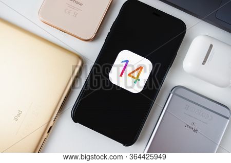 Iphone With Ios 14 Logo On The Screen Close Up, New Operating System 2020 On Apple Devices.