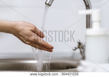 Woman Washes Hands, Squeezes Soap On The Palm On A White Background. Concept Of Protection Against G