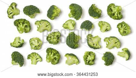 Creative layout made of broccoli. Flat lay, top view. Vegetables isolated over white background. Food ingredient pattern.