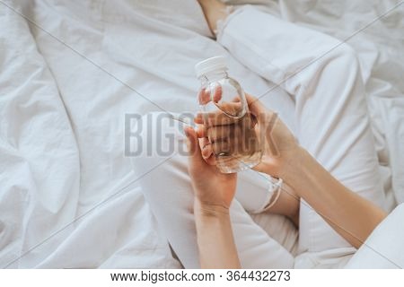 Transparent Bottle Made Of Eco-plastic With Drinking Water In Female Hands.