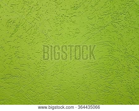 Green Plaster With A Pattern On The Wall