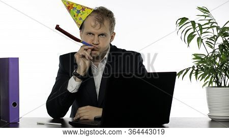 Drank Sleepy Young Clerk Man With Hangover Sitting At The Office Desk Blowing A Whistle. Emotions. D
