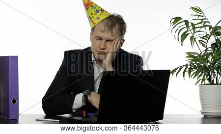 Drank Sleepy Young Clerk Man Sitting At The Office Desk With A Hangover Falling Asleep. Emotions. Di