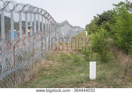 Border Fence Between Subotica (serbia) & Kelebia (hungary) With Boundary Marker. This Border Wall Wa