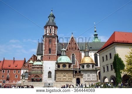 Krakow, Poland - June 6, 2009: Saints Peter And Paul Church In Krakow With Tourists Entering. Also C