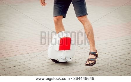 Young Man Driving On Solowheel In The Park.