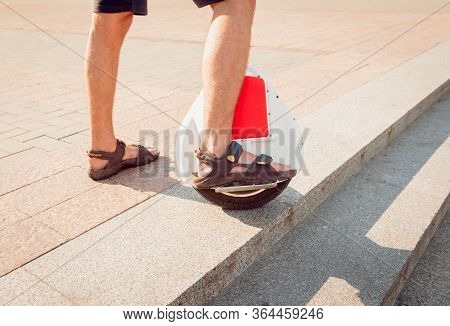 Young Man Driving On Solowheel In The Park.