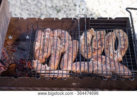 Cooking Kebabs On The Grill. Cooking Meat On A Fire In Nature.