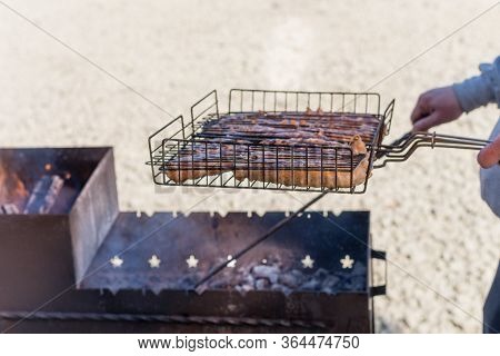 Cooking Kebabs On The Grill. Cooking Meat On A Fire In Nature.