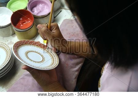 Artist Painting Benjarong Ceramic Ware