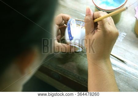 Artist Painting Benjarong Ceramic Ware