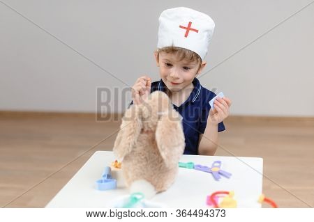 A Five-year-old Boy Plays A Doctor And A Toy Hare Comes To See Him, The Doctor Treats Him With Pills