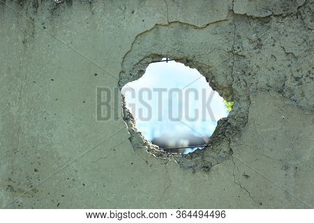 Old Concrete Fence With Hole On Blue Sky View. Wall With Broken Tiles, Use As Horror Scene, Backgrou