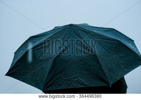 Alone Man Standing Out In Rain With An Umbrella