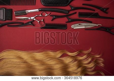 Combs And Hairdresser Tools On Red Background Top View.