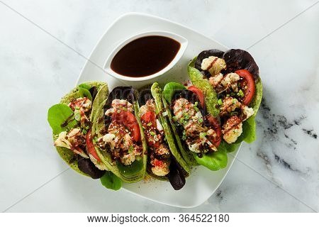 Gluten-free Vegan Green Tachos Made From Chickpea Flour With Spinach And Toppings From Baked Caulifl