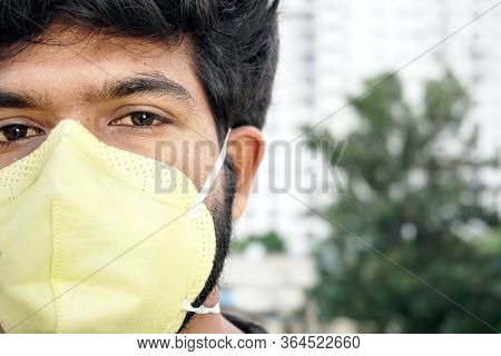 Indian Man In Yellow Protective Face Mask