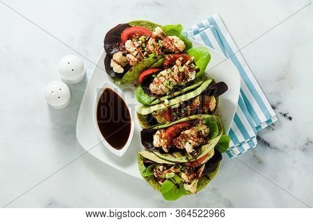 Gluten-free Vegan Green Tachos Made From Chickpea Flour With Spinach And Toppings From Baked Caulifl