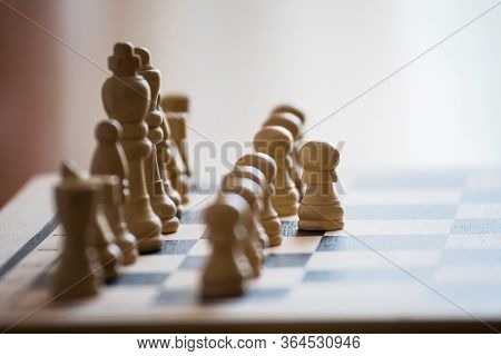 Chess Pieces On The Chess Board With Selective Focus And Crop Fragment. Business And Motivation Conc