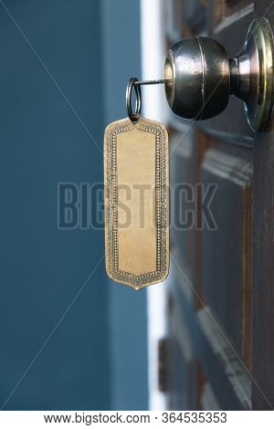 Key With Metal Empty Keyring In Wooden Door Knob, Copy Space
