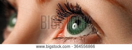 Female Left Blue Eye Tinted In Green Colour With Special Contact Lens Close-up