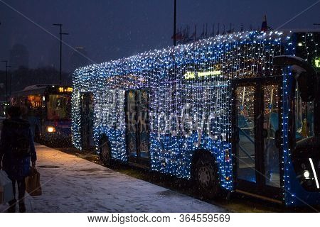 Moscow, Russia - January 2020: An Electric Bus (electrobus) Decorated With New Year Garlands In The 