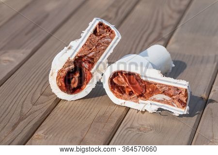 Old Cut Sludge Polypropylene Plumbing Pipes With Red Rust And Limescale. Corrosion, Sludge And Hard 