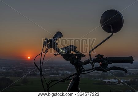 Handlebar Mirror And Light On Electric Bike In Sunset Color Evening
