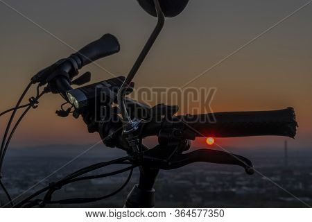 Handlebar Mirror And Light On Electric Bike In Sunset Color Evening