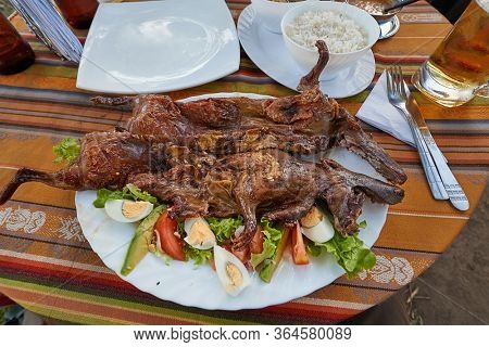 Cuy, Guinea pig served on a plate as a traditional food delicacy in South America