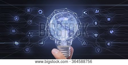 Innovations In Business. Light Bulb With 3d Proection Of Globe And Diverse Business Icons Over Black